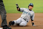 OAKLAND, CA - SEPTEMBER 02: Ichiro Suzuki #51 of the Seattle Mariners hits a single and slides into third on a two base error by Michael Taylor #23 of the Oakland Athletics in the first inning during an MLB baseball game at O.co Coliseum on September 2, 2011 in Oakland, California.  (Photo by Thearon W. Henderson/Getty Images)