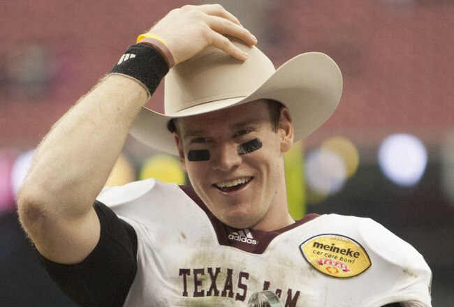 HOUSTON - DECEMBER 31:  Quarterback Ryan Tannehill #17 of Texas A&M Texas A&M Aggies holds his MVP trophy after Texas A&M defeated Northwesten University 33-22 at Reliant Stadium on December 31, 2011 in Houston, Texas.  (Photo by Bob Levey/Getty Images)