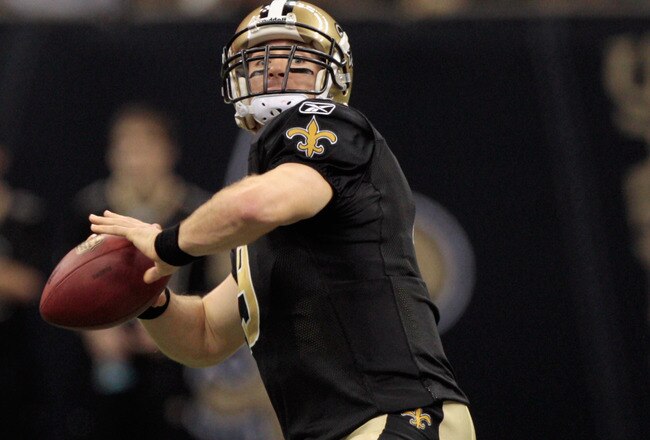 NEW ORLEANS, LA - JANUARY 01:  Drew Brees #9 of the New Orleans Saints looks to throw a pass during the game against the Carolina Panthers at the Mercedes-Benz Superdome on January 1, 2012 in New Orleans, Louisiana.  (Photo by Chris Graythen/Getty Images)