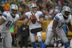 GREEN BAY, WI - JANUARY 01:  Matthew Stafford #9 of the Detroit Lions drops back to pass against the Green Bay Packers at Lambeau Field on January 1, 2012 in Green Bay, Wisconsin. The Packers defeated the Lions 45-41.  (Photo by Jonathan Daniel/Getty Images)