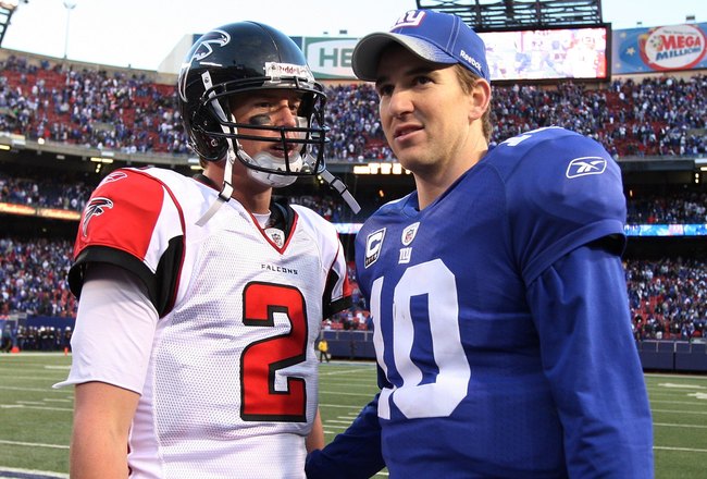 EAST RUTHERFORD, NJ - NOVEMBER 22:  Eli Manning #10 of the New York Giants talks with Matt Ryan #2 of the Atlanta Falcons after their game on November 22, 2009 at Giants Stadium in East Rutherford, New Jersey. The Giants defeated the Falcons 34-31 in overtime.  (Photo by Jim McIsaac/Getty Images)