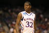 SAN ANTONIO, TX - MARCH 25:  Josh Selby #32 of the Kansas Jayhawks looks on during the southwest regional of the 2011 NCAA men's basketball tournament against the Richmond Spiders at the Alamodome on March 25, 2011 in San Antonio, Texas. Kansas defeated Richmond 77-57.  (Photo by Jamie Squire/Getty Images)