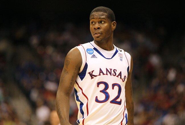 SAN ANTONIO, TX - MARCH 25:  Josh Selby #32 of the Kansas Jayhawks looks on during the southwest regional of the 2011 NCAA men's basketball tournament against the Richmond Spiders at the Alamodome on March 25, 2011 in San Antonio, Texas. Kansas defeated Richmond 77-57.  (Photo by Jamie Squire/Getty Images)