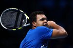 LONDON, ENGLAND - NOVEMBER 27:  Jo-Wilfried Tsonga of France returns the ball during the men's final singles match against Roger Federer of Switzerland during the Barclays ATP World Tour Finals at the O2 Arena on November 27, 2011 in London, England. during the Barclays ATP World Tour Finals at the O2 Arena on November 27, 2011 in London, England.  (Photo by Clive Brunskill/Getty Images)