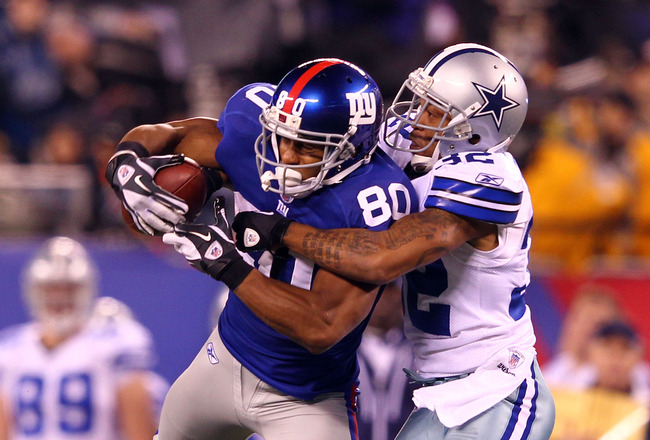 EAST RUTHERFORD, NJ - JANUARY 01:  Victor Cruz #80 of the New York Giants goes up to make a catch against  Orlando Scandrick #32 of the Dallas Cowboys in the fourth quarter at MetLife Stadium on January 1, 2012 in East Rutherford, New Jersey.  (Photo by Al Bello/Getty Images)