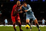 MANCHESTER, ENGLAND - JANUARY 03:  Edin Dzeko of Manchester City competes with Martin Skrtel of Liverpool during the Barclays Premier League match between Manchester City and Liverpool at the Etihad Stadium on January 3, 2012 in Manchester, England.  (Photo by Clive Brunskill/Getty Images)