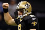 NEW ORLEANS, LA - JANUARY 07:  Drew Brees #9 of the New Orleans Saints celebrates after a touchdown in the second quarter against the Detroit Lions during their 2012 NFC Wild Card Playoff game at Mercedes-Benz Superdome on January 7, 2012 in New Orleans, Louisiana.  (Photo by Chris Graythen/Getty Images)