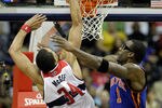 WASHINGTON, DC - JANUARY 06: JaVale McGee #34 of the Washington Wizards puts up a shot over the defense of Amare Stoudemire #1 of the New York Knicks at Verizon Center on January 6, 2012 in Washington, DC.  NOTE TO USER: User expressly acknowledges and agrees that, by downloading and or using this photograph, User is consenting to the terms and conditions of the Getty Images License Agreement.  (Photo by Rob Carr/Getty Images)