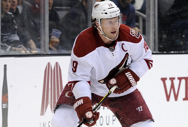LOS ANGELES, CA - JANUARY 05:  Shane Doan #19 of the Phoenix Coyotes controls the puck behind the net against the Los Angeles Kings at Staples Center on January 5, 2012 in Los Angeles, California.  (Photo by Harry How/Getty Images)