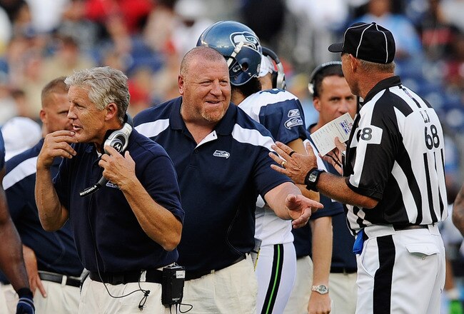 SAN DIEGO, CA - AUGUST 11: Assistant head coach Tom Cable (C) of the Seattle Seahawks points at  line judge Tom Stephan #68 during the NFL preseason game at Qualcomm Stadium against the San Diego Chargers on August 11, 2011 in San Diego, California.  (Photo by Kevork Djansezian/Getty Images)