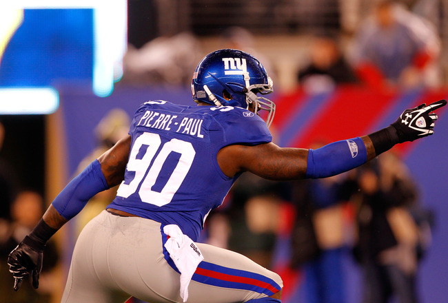 EAST RUTHERFORD, NJ - JANUARY 01:   Jason Pierre-Paul #90 of the New York Giants reacts after a sack in the first quarter against the Dallas Cowboys at MetLife Stadium on January 1, 2012 in East Rutherford, New Jersey.  (Photo by Rich Schultz/Getty Images)