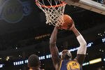 LOS ANGELES, CA - JANUARY 06: Kwame Brown #54 of the Golden State Warriors shoots over Andrew Bynum #17 of the Los Angeles Lakers at Staples Center on January 6, 2012 in Los Angeles, California.  The Lakers won 97-90. NOTE TO USER: User expressly acknowledges and agrees that, by downloading and or using this photograph, User is consenting to the terms and conditions of the Getty Images License Agreement.   (Photo by Stephen Dunn/Getty Images)