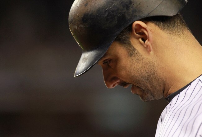 NEW YORK, NY - OCTOBER 06:  Jorge Posada #20 of the New York Yankees walks back to the dugout with his head down after he grounded out in the bottom of the eighth inning against the Detroit Tigers during Game Five of the American League Championship Series at Yankee Stadium on October 6, 2011 in the Bronx borough of New York City.  (Photo by Nick Laham/Getty Images)
