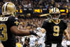 NEW ORLEANS, LA - JANUARY 07:  Drew Brees #9 of the New Orleans Saints celebrates with  Darren Sproles #43 after Sproles' touchdown in the second quarter against the Detroit Lions during their 2012 NFC Wild Card Playoff game at Mercedes-Benz Superdome on January 7, 2012 in New Orleans, Louisiana.  (Photo by Kevin C. Cox/Getty Images)
