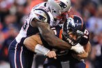 DENVER, CO - DECEMBER 18: Defensive end Mark Anderson #95 of the New England Patriots sacks quarterback Tim Tebow #15 of the Denver Broncos in the third quarter at Sports Authority Field at Mile High on December 18, 2011 in Denver, Colorado. The New England Patriots won, 41-23 (Photo by Patrick Smith/Getty Images)