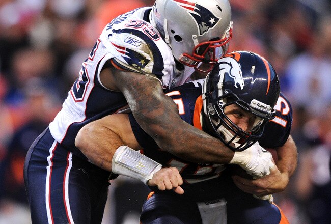 DENVER, CO - DECEMBER 18: Defensive end Mark Anderson #95 of the New England Patriots sacks quarterback Tim Tebow #15 of the Denver Broncos in the third quarter at Sports Authority Field at Mile High on December 18, 2011 in Denver, Colorado. The New England Patriots won, 41-23 (Photo by Patrick Smith/Getty Images)