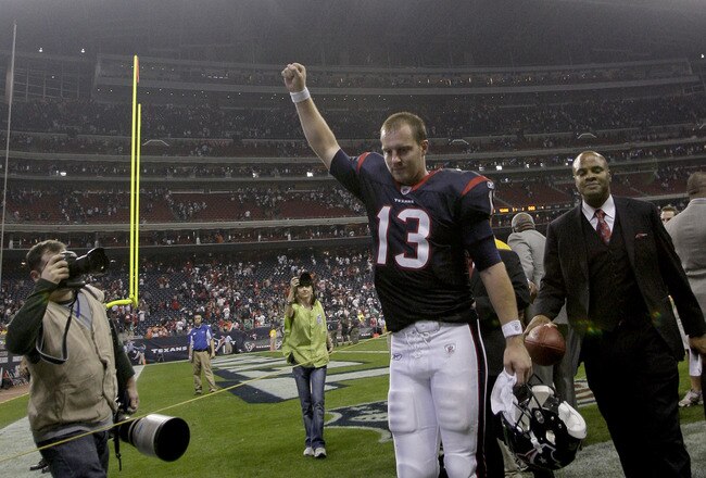 HOUSTON, TX - JANUARY 7: Quarterback T.J. Yates #13 of the Houston Texans raises his arm as he leaves the field after the Houston Texans defeated the Cincinnati Bengals in the 2012 AFC Wild Card Playoff game at Reliant Stadium on January 7, 2012 in Houston, Texas.The Texans defeated the Bengals 31-10.  (Photo by Thomas B. Shea/Getty Images)