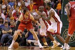 MIAMI, FL - APRIL 06:  Andrew Bogut #6 of the Milwaukee Bucks posts up  Joel Anthony #50 and LeBron James #6 of the Miami Heat during a game at American Airlines Arena on April 6, 2011 in Miami, Florida. NOTE TO USER: User expressly acknowledges and agrees that, by downloading and/or using this Photograph, User is consenting to the terms and conditions of the Getty Images License Agreement.  (Photo by Mike Ehrmann/Getty Images)