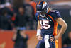 DENVER, CO - DECEMBER 18: Tim Tebow #15 of the Denver Broncos walks off the field with his head down in the closing moments against the New England Patriots on December 18, 2011 during the first half at Sports Authority Field at Mile High in Denver, Colorado. The New England Patriots won the game 41-23. (Photo by Marc Piscotty/Getty Images)