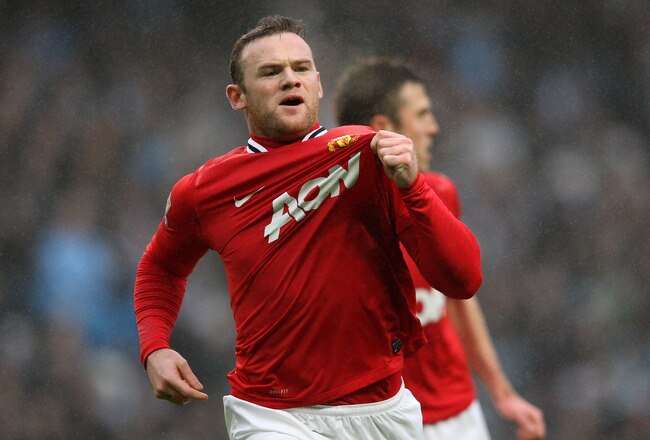 MANCHESTER, ENGLAND - JANUARY 08:  Wayne Rooney of Manchester United celebrates scoring the opening goal during the FA Cup Third Round match between Manchester City and Manchester United at the Etihad Stadium on January 8, 2012 in Manchester, England.  (Photo by Alex Livesey/Getty Images)