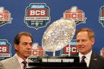 NEW ORLEANS, LA - JANUARY 08:  Head coach Nick Saban of the Alabama Crimson Tide and head coach Les Miles of the LSU Tigers pose with The Coaches' Trophy during the Allstate BCS Championship Press Conference on January 8, 2012 in New Orleans, Louisiana.  (Photo by Kevin C. Cox/Getty Images)