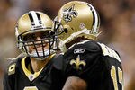 NEW ORLEANS, LA - JANUARY 07:  Drew Brees #9 and  Robert Meachem #17 of the New Orleans Saints celebrate after their touchdown in the fourth quarter against the Detroit Lions during their 2012 NFC Wild Card Playoff game at Mercedes-Benz Superdome on January 7, 2012 in New Orleans, Louisiana.  (Photo by Kevin C. Cox/Getty Images)