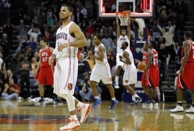 CHARLOTTE, NC - JANUARY 06:  D.J. Augustin #14 of the Charlotte Bobcats reacts to the end of regulation during their game that went into overtime against the Atlanta Hawks at Time Warner Cable Arena on January 6, 2012 in Charlotte, North Carolina.  NOTE TO USER: User expressly acknowledges and agrees that, by downloading and or using this photograph, User is consenting to the terms and conditions of the Getty Images License Agreement.  (Photo by Streeter Lecka/Getty Images)