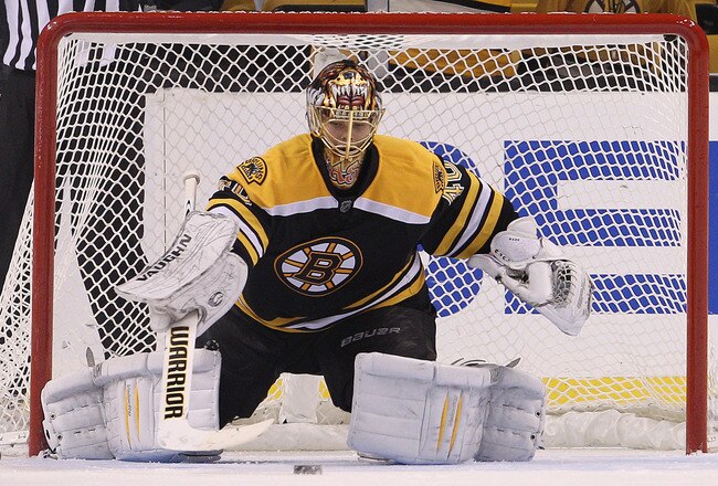 BOSTON, MA - JANUARY 05:  Tuukka Rask #40 of the Boston Bruins stops a shot in the third period against the Calgary Flames on January 5, 2012 at TD Garden in Boston, Massachusetts. The Boston Bruins defeated the Calgary Flames 9-0.  (Photo by Elsa/Getty Images)