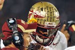 ORLANDO, FL - DECEMBER 29: Coach Jimbo Fisher gives a play to quarterback E. J. Manuel #3 of the Florida State Seminoles during play against the Notre Dame Fighting Irish in the Champs Sports Bowl December 29, 2011 at the Florida Citrus Bowl in Orlando, Florida.  FSU won 18 - 14. (Photo by Al Messerschmidt/Getty Images)