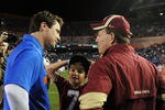 GAINESVILLE, FL - NOVEMBER 26:  Coach Jimbo Fisher of the Florida State Seminoles and his son Trey greet coach Will Muschamp of the Florida Gators at midfield before play November 26, 2011 at Ben Hill Griffin Stadium in Gainesville, Florida.  (Photo by Al Messerschmidt/Getty Images)
