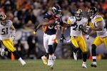 DENVER, CO - JANUARY 08:  Demaryius Thomas #88 of the Denver Broncos stiff arms Ike Taylor #24 of the Pittsburgh Steelers to score an 80 yard touchdown in overtime during the AFC Wild Card Playoff game at Sports Authority Field at Mile High on January 8, 2012 in Denver, Colorado. The Denver Broncos defeated the the Pittsburgh Steelers in over time 23 - 29.  (Photo by Doug Pensinger/Getty Images)