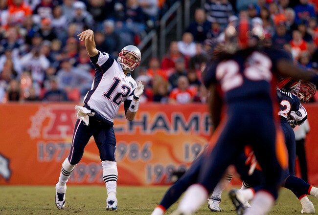 DENVER, CO - DECEMBER 18:  Quarterback Tom Brady #12 of the New England Patriots throws a pass against the Denver Broncos during the second quarter at Sports Authority Field at Mile High on December 18, 2011 in Denver, Colorado. The Broncos defeated the Bears 13-10 in overtime. (Photo by Justin Edmonds/Getty Images)