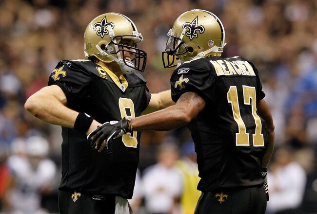 NEW ORLEANS, LA - JANUARY 07:  Drew Brees #9 and  Robert Meachem #17 of the New Orleans Saints celebrate after their touchdown in the fourth quarter against the Detroit Lions during their 2012 NFC Wild Card Playoff game at Mercedes-Benz Superdome on January 7, 2012 in New Orleans, Louisiana.  (Photo by Kevin C. Cox/Getty Images)
