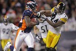 DENVER, CO - JANUARY 08:  Demaryius Thomas #88 of the Denver Broncos makes a pass reception and fights off Ike Taylor #24 of the Pittsburgh Steelers to go 80 yards for the game winning touchdown on the first play of overtime at Sports Authority Field at Mile High on January 8, 2012 in Denver, Colorado. The Broncos defeated the Steelers 29-23 in their AFC Wild Card Playoff game.  (Photo by Doug Pensinger/Getty Images)
