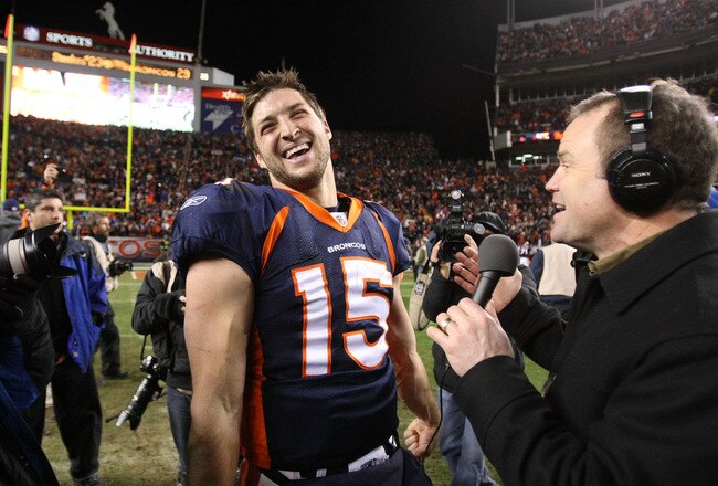 DENVER, CO - JANUARY 08:  Tim Tebow #15 of the Denver Broncos talks to the media after defeating the Pittsburgh Steelers in overtime of the AFC Wild Card Playoff game at Sports Authority Field at Mile High on January 8, 2012 in Denver, Colorado. The Denver Broncos defeated the the Pittsburgh Steelers in overtime 23 - 29.  (Photo by Jeff Gross/Getty Images)