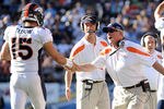 SAN DIEGO, CA - NOVEMBER 27:  Head coach John Fox of the Denver Broncos celebrates a touchdown with Tim Tebow #15 to trail 10-7 to the San Diego Chargers during the second quarter at Qualcomm Stadium on November 27, 2011 in San Diego, California.  (Photo by Harry How/Getty Images)