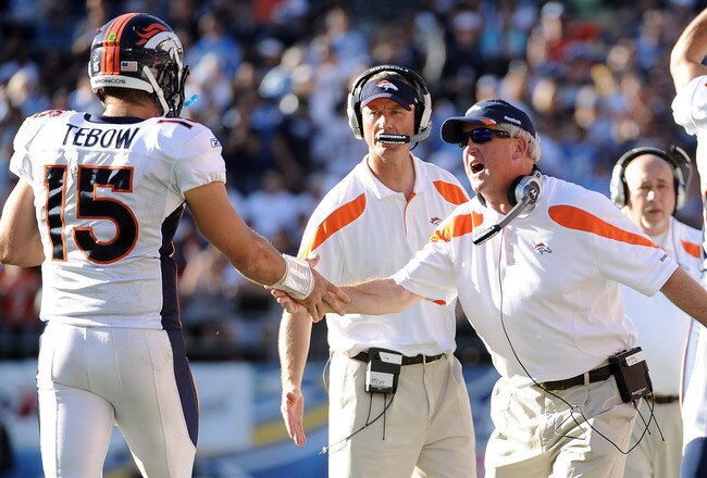 SAN DIEGO, CA - NOVEMBER 27:  Head coach John Fox of the Denver Broncos celebrates a touchdown with Tim Tebow #15 to trail 10-7 to the San Diego Chargers during the second quarter at Qualcomm Stadium on November 27, 2011 in San Diego, California.  (Photo by Harry How/Getty Images)