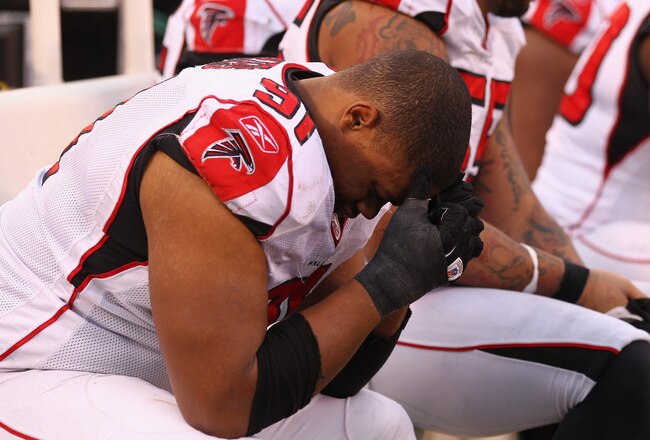 EAST RUTHERFORD, NJ - JANUARY 08:  Corey Peters #91 of the Atlanta Falcons hangs his head dejected on the bench against the New York Giants during their NFC Wild Card Playoff game at MetLife Stadium on January 8, 2012 in East Rutherford, New Jersey. The GIants won 24-2.  (Photo by Al Bello/Getty Images)