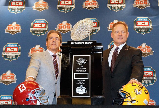NEW ORLEANS, LA - JANUARY 08:  Head coach Nick Saban of the Alabama Crimson Tide and head coach Les Miles of the LSU Tigers pose with The Coaches' Trophy during the Allstate BCS Championship Press Conference on January 8, 2012 in New Orleans, Louisiana.  (Photo by Kevin C. Cox/Getty Images)