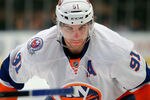 NEW YORK, NY - DECEMBER 26:  John Tavares #91 of the New York Islanders waits for a faceoff in an NHL hockey game against the New York Rangers at Madison Square Garden on December 26, 2011 in New York City.  (Photo by Paul Bereswill/Getty Images)