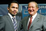 LAS VEGAS - DECEMBER 06:  Manny Pacquiao of the Philippines (L) and boxing promoter Bob Arum appear at a news conference following Pacquiao's victory over Oscar De La Hoya in their welterweight bout at the MGM Grand Garden Arena on December 6, 2008 in Las Vegas, Nevada.  (Photo by Ethan Miller/Getty Images)