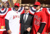 ANAHEIM, CA - DECEMBER 10:  Angels owner Arturo Moreno stands between Albert Pujols #5 and C.J. Wilson #33 at a public press conference introducing them as newly signed Los Angeles Angels of Anaheim  players at Angel Stadium on December 10, 2011 in Anaheim, California.  (Photo by Stephen Dunn/Getty Images)
