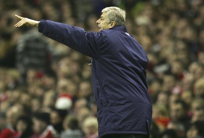 LIVERPOOL, UNITED KINGDOM - JANUARY 06: Arsenal Manager Arsene Wenger issues instructions to his players during the FA Cup sponsored by E.ON Third Round match between Liverpool and Arsenal at Anfield on January 6, 2007 in Liverpool, England. (Photo by Phil Cole/Getty Images)