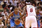 MIAMI, FL - MARCH 16: LeBron James #6 of the Miami Heat is guarded by Kevin Durant #35 of the Oklahoma City Thunder during a game at American Airlines Arena on March 16, 2011 in Miami, Florida. NOTE TO USER: User expressly acknowledges and agrees that, by downloading and/or using this Photograph, User is consenting to the terms and conditions of the Getty Images License Agreement.  (Photo by Mike Ehrmann/Getty Images)