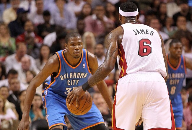MIAMI, FL - MARCH 16: LeBron James #6 of the Miami Heat is guarded by Kevin Durant #35 of the Oklahoma City Thunder during a game at American Airlines Arena on March 16, 2011 in Miami, Florida. NOTE TO USER: User expressly acknowledges and agrees that, by downloading and/or using this Photograph, User is consenting to the terms and conditions of the Getty Images License Agreement.  (Photo by Mike Ehrmann/Getty Images)