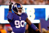 EAST RUTHERFORD, NJ - JANUARY 01:  Jason Pierre-Paul #90 of the New York Giants reacts after a sack in the first quarter against the Dallas Cowboys at MetLife Stadium on January 1, 2012 in East Rutherford, New Jersey.  (Photo by Rich Schultz/Getty Images)
