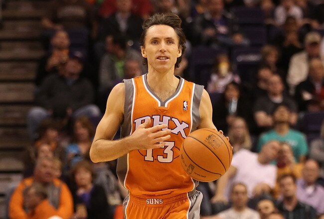 PHOENIX, AZ - DECEMBER 26:  Steve Nash #13 of the Phoenix Suns handles the ball during the season openning NBA game against the New Orleans Hornets at US Airways Center on December 26, 2011 in Phoenix, Arizona.  The Hornets defeated the Suns 85-84. NOTE TO USER: User expressly acknowledges and agrees that, by downloading and or using this photograph, User is consenting to the terms and conditions of the Getty Images License Agreement.  (Photo by Christian Petersen/Getty Images)