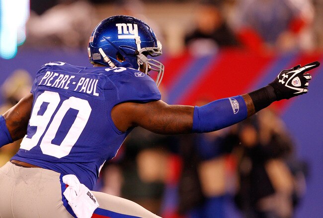 EAST RUTHERFORD, NJ - JANUARY 01:   Jason Pierre-Paul #90 of the New York Giants reacts after a sack in the first quarter against the Dallas Cowboys at MetLife Stadium on January 1, 2012 in East Rutherford, New Jersey.  (Photo by Rich Schultz/Getty Images)