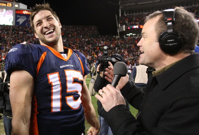 DENVER, CO - JANUARY 08:  Tim Tebow #15 of the Denver Broncos talks to the media after defeating the Pittsburgh Steelers in overtime of the AFC Wild Card Playoff game at Sports Authority Field at Mile High on January 8, 2012 in Denver, Colorado. The Denver Broncos defeated the the Pittsburgh Steelers in overtime 23 - 29.  (Photo by Jeff Gross/Getty Images)