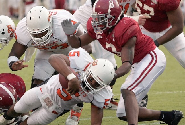 SHREVEPORT, LA - DECEMBER 28:  Keith Toston #5 of Oklahoma State makes a touchdown against Alabama on December 28, 2006 during the PetroSun Independence Bowl at Independence Stadium in Shreveport, Louisiana. (Photo by Chris Graythen/Getty Images)